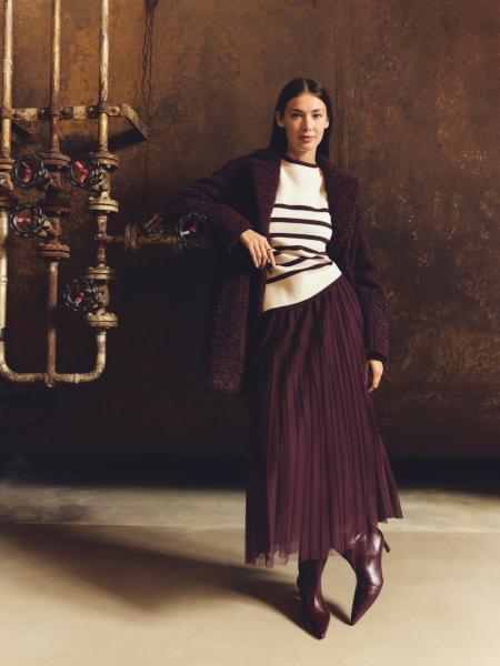 ĮKŪNYTAS MOTERIŠKUMAS